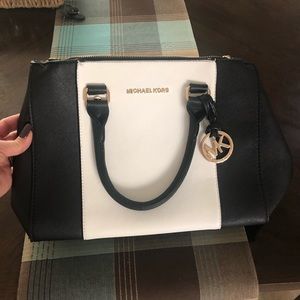 Black and white probably not authentic mk purse